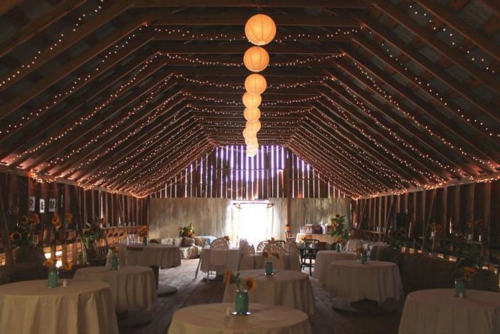 Like a fairy land: lights lighting up the barn and makes it look like a very romantic place for your wedding reception!