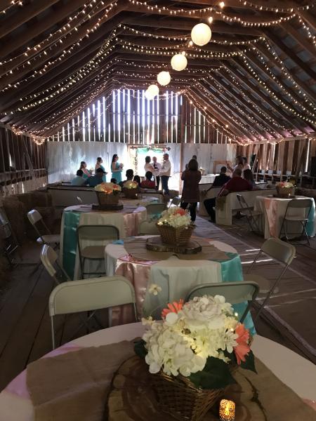 Country Casual, yet so elegant, Nikkie chose coral, peach and teal for her color scheme, accented by burlap and tea lit candles on each table.  Overhead twinkle lights and lit paper lanterns completed the setting of her very romantic ceremony and reception.