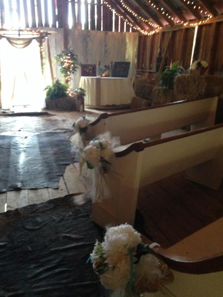 Sara and Eric laid down authentic cowhide rugs for their walk down the aisle!