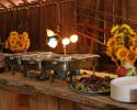 Contact us to plan your perfect wedding menu!  This table is actually a fourteen foot, rough-sawn wooden slab, cut from a giant elm tree right here at Hidden Valley Guest Ranch.  It rests on wooden spindles, offering just the right country vibe.